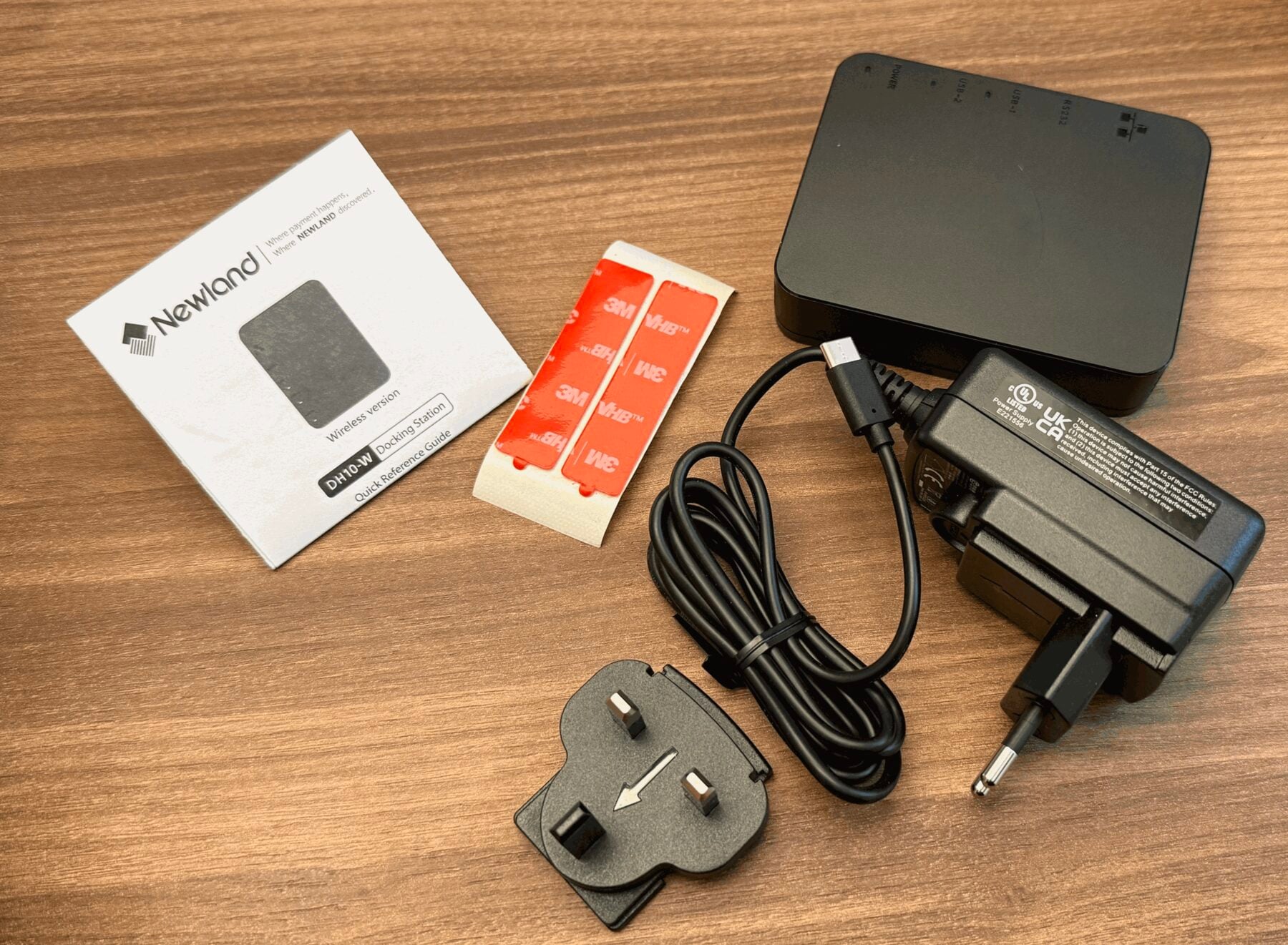 What ships in the box: the Hub, power adapter with EU and UK plug heads, double-sided tape and the quick reference guide